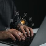 A lone entrepreneur working on a laptop in a dimly lit room with subtle AI interface visuals, representing a one-person startup powered by artificial intelligence.